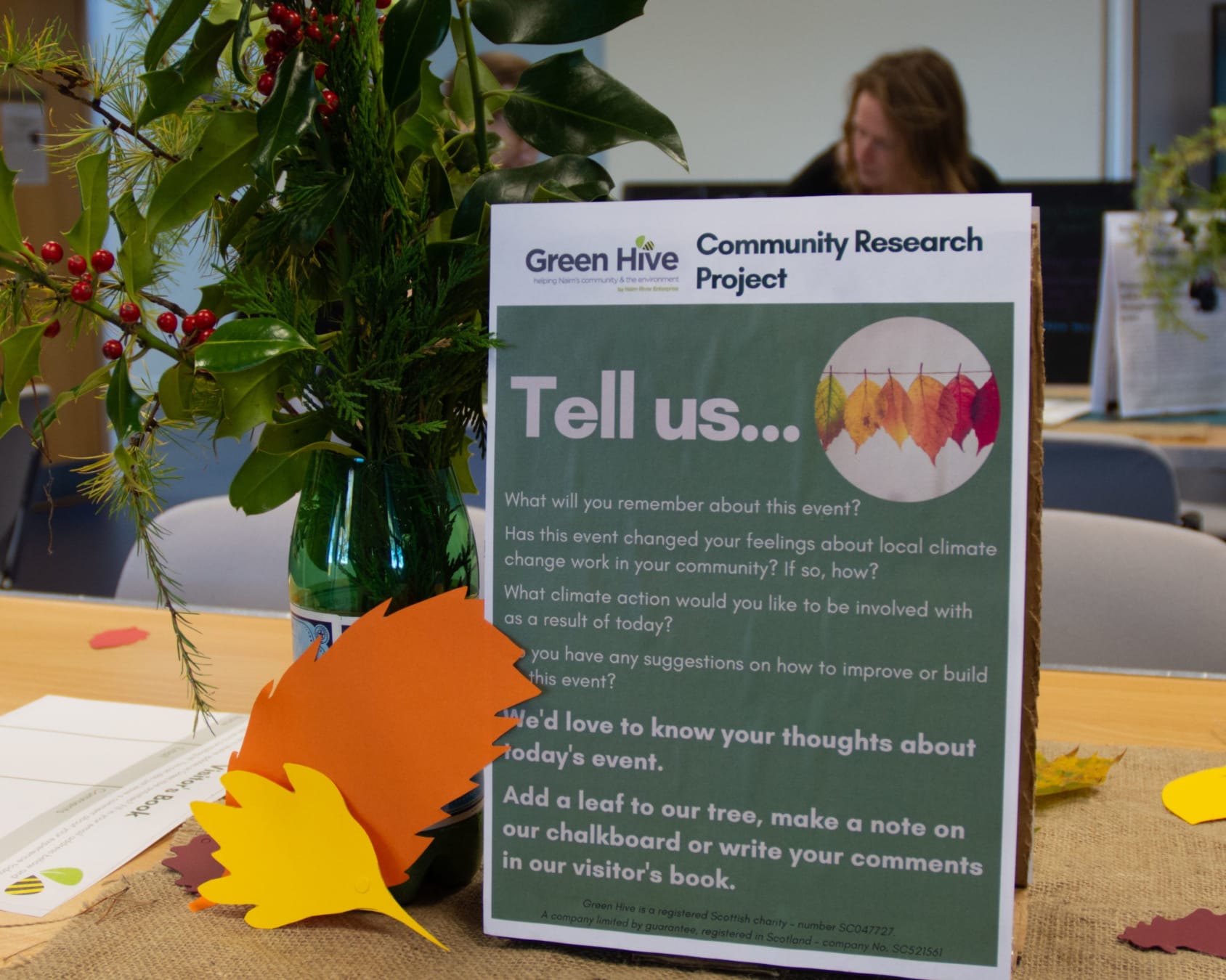 Sign on a table asking people to share their thoughts on local climate change concerns in Nairn