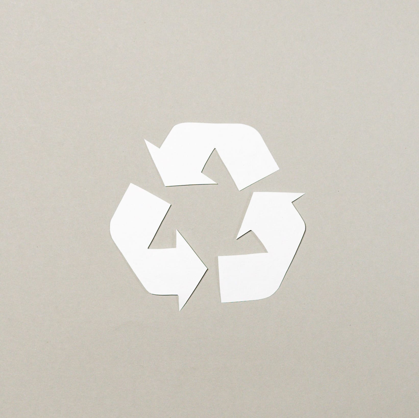 Recycling logo with three arrows adjoined in a triangle