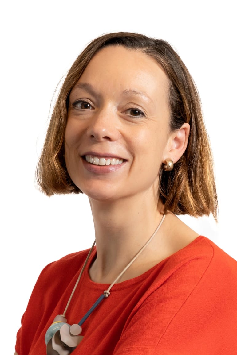 Headshot of Hannah Russell, British Science Association Chief Executive; short brown hair in red top with statement necklace